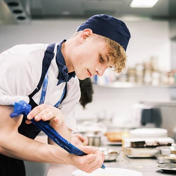 young person in catering whites
