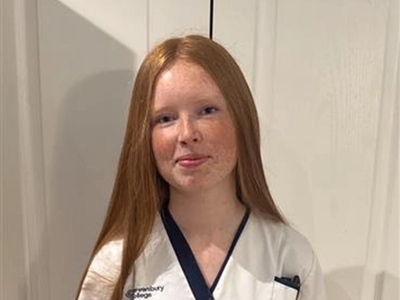Head and shoulders photo of Gracie in a nurse's uniform 