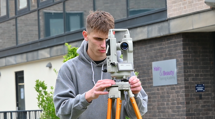 Students on snowy ground on a mountain top