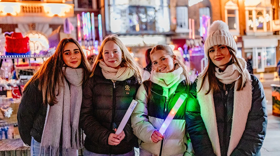 Students holding glow sticks