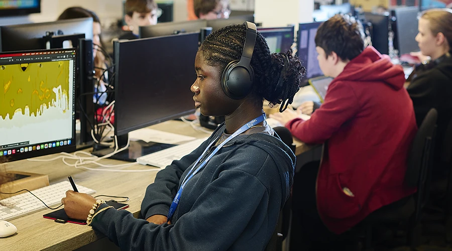 Student using digital pen to create artwork